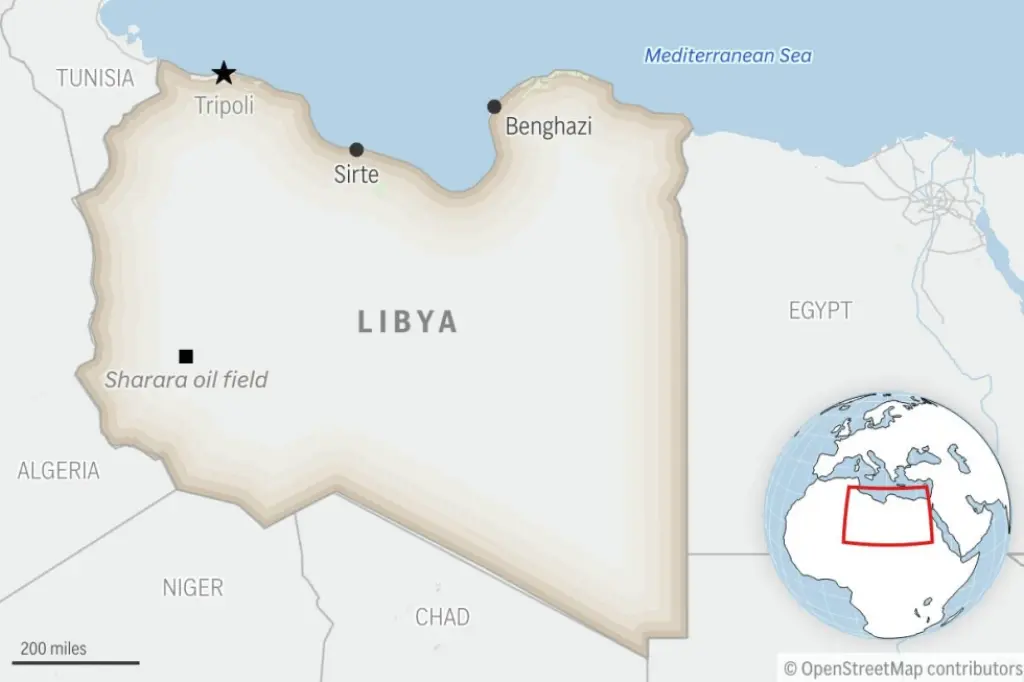 A Europe-bound migrant boat capsizes off the Libyan coast, leaving at least 15 people dead
