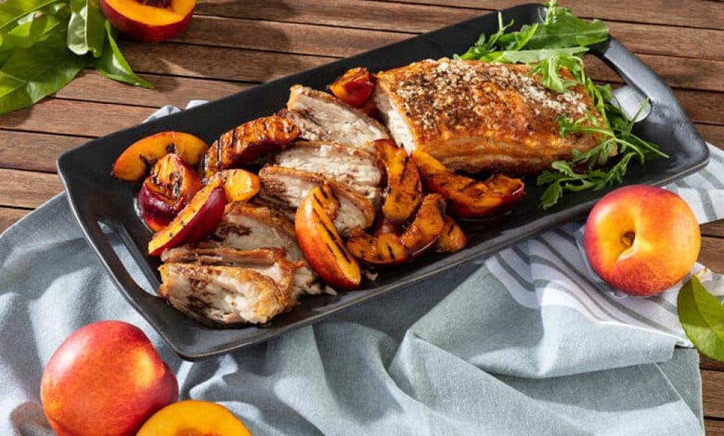 Crispy pork belly served with nectarine and wine sauce